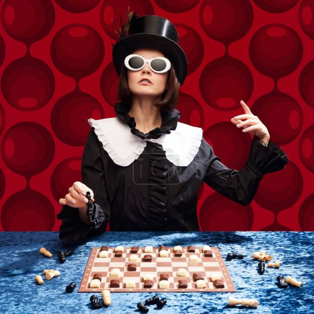 Photo for Lord of chocolate. Stylish woman in cylinder hat and sunglasses playing chess with candie figures against red pattern background. Concept of pop art, creativity, food, inspiration, fashion - Royalty Free Image