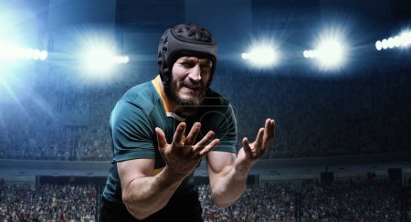 Photo for Loosing game. Man, professional rugby player in uniform standing despair and sadness at 3D stadium with flashlights. Concept of sport, competition, game, emotions - Royalty Free Image