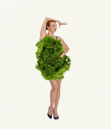 Photo for Redhead young beautiful woman wearing lettuce, greens dress over white background. Nutritionist. Contemporary art collage. Concept of healthy eating, food, diet, body-positivity, care, beauty - Royalty Free Image