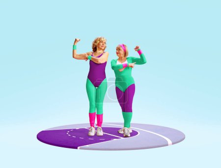 Photo for Two middle-aged, senior woman in colorful, stylish sportswear posing, showing muscles against light blue background. Concept of sportive lifestyle, health care, action and motion. Copy space for ad - Royalty Free Image