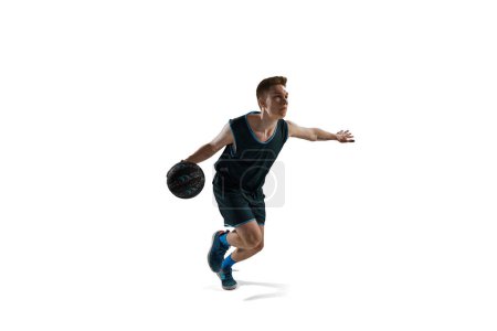 Photo for Dynamic image of young man, athlete running with ball, playing basketball isolated against white background. Concept of sport, action and motion, health, game, hobby, sportswear, ad - Royalty Free Image