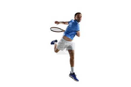 Photo for Dynamic image of concentrated man, professional tennis player in motion with racket isolated over white background. Concept of sport, active lifestyle, game, hobby, health, dynamics, ad - Royalty Free Image