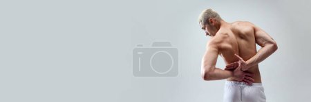 Photo for Cropped image of beautiful, strong, muscular, relief males back against grey studio background. Concept of male natural beauty, body care, health, sport, fashion. Banner. Copy space for ad - Royalty Free Image