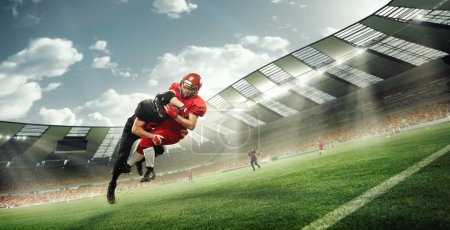 Photo for Dynamic im,age of professional athletes, american football players in motion during tense game at 3D stadium. Competitive spirit. Concept of professional sport, competition, match, action, energy, ad - Royalty Free Image