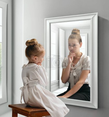 Photo for Creative conceptual collage. Little girl looking in mirror and seeing reflection of young girl, her future self. Growing up process. Concept of present, past and future, age, lifestyle, generation, ad - Royalty Free Image