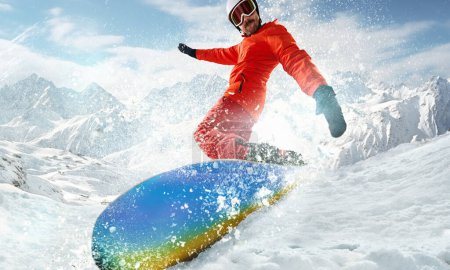 Photo for Active, sportive man in uniform and helmet riding snowboard over snowy mountain background on sunny day. Concept of winter sport, action, motion, hobby, leisure time. Banner. Copy space for ad - Royalty Free Image