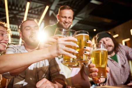 Photo for Friends meeting at bar, pub,watching football match translation, talking, cheering up favorite team. Clinking beer glasses. Concept of sport competition, hobby, lifestyle, human emotions, fun - Royalty Free Image