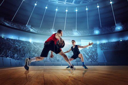 Photo for Motivated and competitive young men, basketball players in motion during match, game playing at 3D arena with flashlights. Concept of professional sport, competition, action, hobby, game. - Royalty Free Image