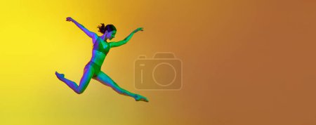 Photo for Dynamic image of young artistic, expressive woman dancing in underwear against gradient yellow orange background in neon. Concept of modern dance style, hobby, art, performance, lifestyle, ad. Banner - Royalty Free Image