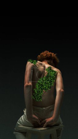 Photo for Back view of shirtless, redhead curly boy with green plants behind. Mental health. Contemporary art collage. Concept of surrealism, psychology, inner world, imagination, diversity. Ad - Royalty Free Image