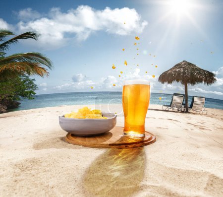 Photo for Glasses of delicious lager beer with with chips appetizers on sand against ocean, palms and blue sky background. Concept of beer, brewery, holidays and vacation, tradition, festival, alcohol drink, ad - Royalty Free Image
