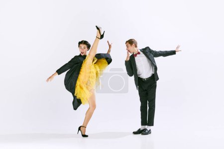 Photo for Funny emotions. Stylish, artistic young man and woman dancing lindy hop isolated on white studio background. Concept of art, hobby, retro dance style, choreography, beauty. Ad - Royalty Free Image