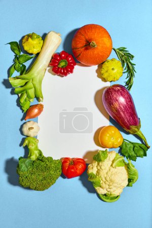 Photo for Top view image of fresh, natural vegetables on blue background. Pumpkin, eggplant, broccoli, pepper, tomato. Concept of vegetables, garden, harvesting, organic food, farmer market. Copy space for ad - Royalty Free Image