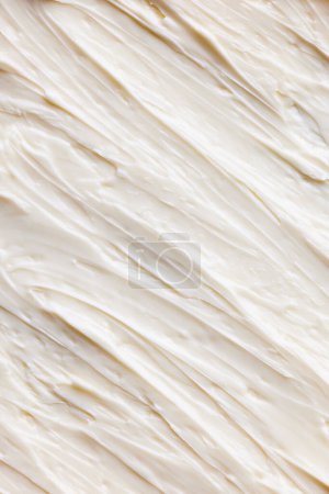 Photo for Close-up of delicious, sweet, organic cream with textured waves. Sweet cream for cakes and desserts. Healthy eating. Concept of food texture, organic products, cooking. Background, wallpaper, poster - Royalty Free Image