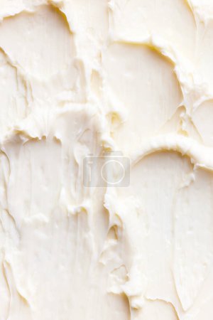 Foto de Primer plano de mantequilla orgánica casera con ondas texturizadas en ella. Alimentación saludable. Concepto de textura de los alimentos, sabor, productos orgánicos, cocina. Fondo, fondo de pantalla, cartel - Imagen libre de derechos