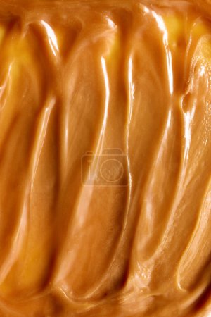 Photo for Close-up of texture of melted, salted caramel with swirls. Delicious, sweet dressings for desserts or topping for drinks. Concept of food, breakfast, snacks, organic, homemade products - Royalty Free Image