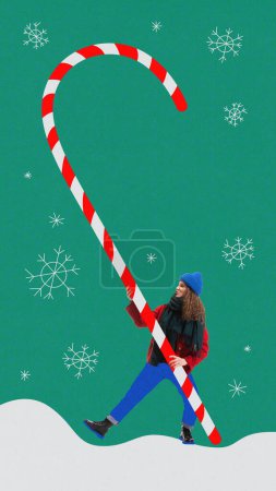 Photo for Beautiful young girl in winter clothes carrying giant candy. Contemporary art collage. Concept of winter holidays, Christmas and New Year, vacation. Creative design. Poster, postcard. Ad - Royalty Free Image