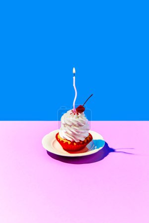 Photo for Delicious sweet cake on plate with cream and birthday candle against blue pink background. Taste of cherry.. Concept of food, desserts, birthday celebration, party. Pop art. Copy space for ad. Poster - Royalty Free Image