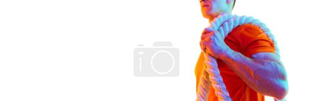 Photo for Cropped image of young sportive man carrying fitness rope for training against white studio background in neon light. Concept of sport, active and healthy lifestyle, body, fitness. Copy space for ad - Royalty Free Image