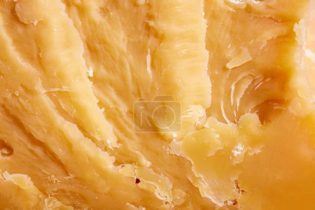 Photo for Close-up image, texture of hard cheese, cheddar. Traditional taste of Italian cheese. Delicious taste. Concept of food, taste, art of organic products, healthy, natural food. - Royalty Free Image