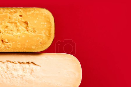 Photo for Textures of different cheese, Parmesan, pecorino, cheddar against red background. Cheese production and store. Concept of food, taste, art of organic products, healthy, natural food. - Royalty Free Image
