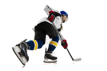 Photo for Young girl, athlete, hockey player in motion, training, playing isolated over white background. Championship. Concept of professional sport, competition, game, action and hobby - Royalty Free Image