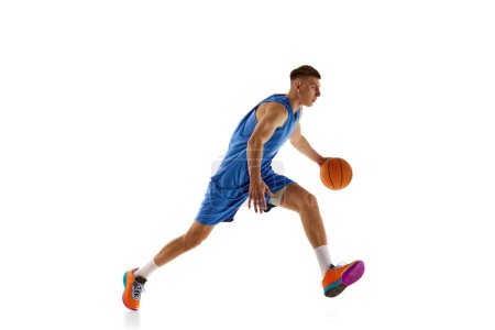 Photo for Young man, athlete in motion, basketball player during game, practicing isolated over white background. Concept of professional sport, competition, match, championship, health, action. Ad - Royalty Free Image