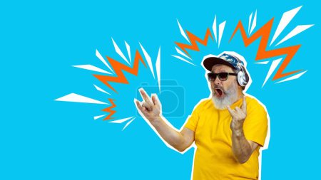 Photo for Rock and roll. Senior excited man listening to music in headphones over blue background. Creative design. Concept of human emotions, senior lifestyle, enjoyment, fun and joy - Royalty Free Image
