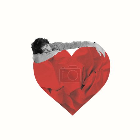 Photo for Young sad man hugging giant heart. Missing love. Contemporary art collage. Minimalism. Valentines Day, holiday, love, February 14th concept. Template for ads, postcard, invitation, poster - Royalty Free Image