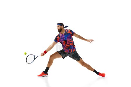 Photo for Bearded man, tennis player practicing, training isolated over white background. Concept of professional sport, movement, competition, action. Ad - Royalty Free Image