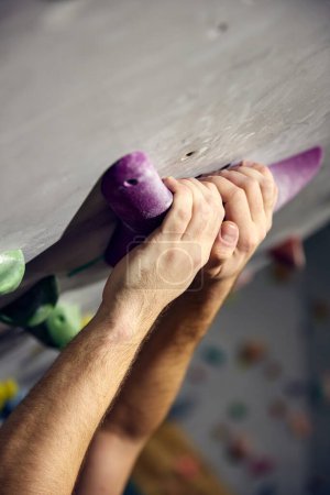 Photo for Close-up of hands in special powder on artificial rock. Bouldering, wall climbing activity. Concept of sport, bouldering, sport climbing, hobby, active lifestyle, school, training course - Royalty Free Image