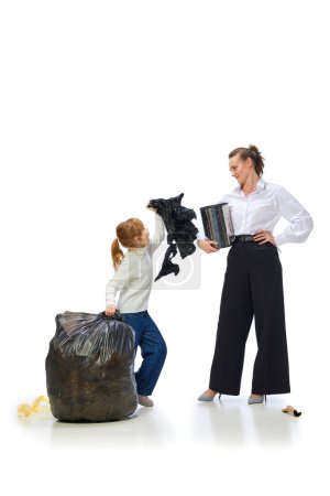 Photo for Mother explaining daughter, child importance of cleaning and taking care after planet isolated over white background. Concept of environment, ecology, nature care, recycling, awareness - Royalty Free Image