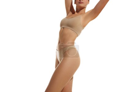Photo for Wellness, weight-loss. Cropped image of slim female body in underwear against white studio background. Concept of natural beauty, health and body care, spa, treatment, diet, sport, epilation - Royalty Free Image