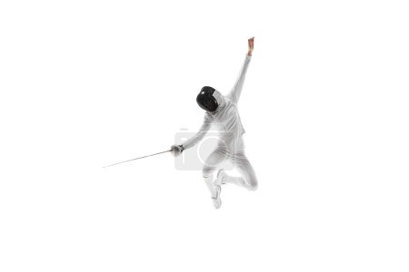 Photo for Strength and grace. Illustrating the combination of strength and grace necessary in the art of fencing. Female athlete, fencer in motion over white background. Concept of sport, competition, hobby - Royalty Free Image