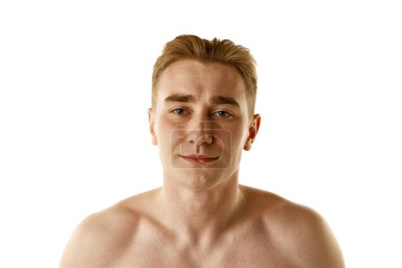 Photo for Portrait of young handsome guy standing shirtless isolated on white background. Skin care morning routine. Concept of male beauty, skin care, cosmetology and cosmetics, health. Ad for beauty products - Royalty Free Image