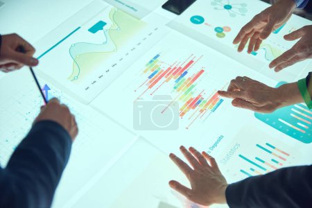 Photo for Colleagues, project managers working with analytical papers, looking on charts, metrics and KPI, analyzing profitable and promotional strategies for project development. Concept of business, teamwork - Royalty Free Image