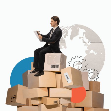 Photo for Man sitting on cardboard boxes and making notes over world map background. Global distribution. Creative modern design. Concept of logistics, cargo companies, worldwide shipping and delivery services - Royalty Free Image