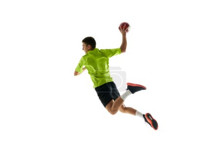 Photo for Competitive and concentrated young guy, handball player in motion during game, training against white studio background. Concept of professional sport, tournament, competition - Royalty Free Image
