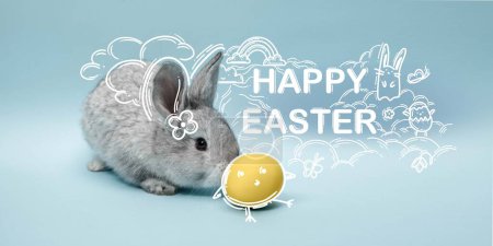 Photo for Creative banner related to Easter holiday with bunny and colored eggs against blue background. Seasonal website cover. Template for banner, poster, postcards and greeting cards, ad - Royalty Free Image