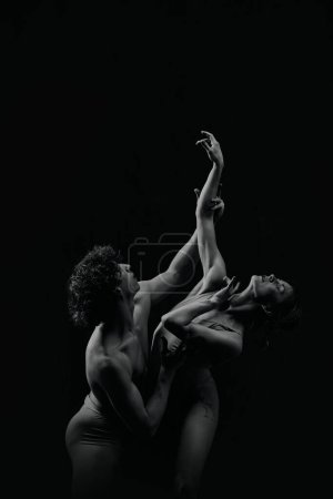 Photo for Passion, inspiration and feelings. Talented, artistic young man and woman, ballet dancers making performance, dancing. Monochrome. Concept of classic art, aesthetics, emotions, ballet dance, talent - Royalty Free Image