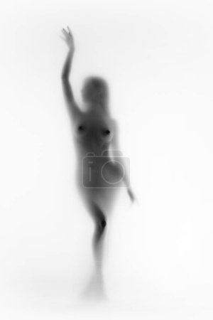 Photo for Blurred silhouette of tender female body. Promotional material for womens health, focusing on body positivity. Monochrome image. Concept of body aesthetics, femininity, beauty, health, art - Royalty Free Image