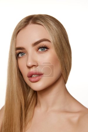 Photo for Portrait of elegant, attractive young woman with straight blonde air, smooth, clean skin and plump lips isolated on white studio background. Concept of natural beauty, cosmetology, cosmetics, skincare - Royalty Free Image