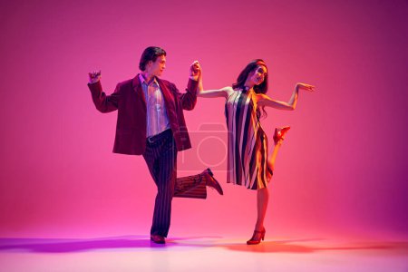 Event poster. 50s themed parties, musical events, capturing eras vibe. Young man and woman dancing against pink background in neon light. Concept of hobby, dance class, party, 50s, 60s culture, youth