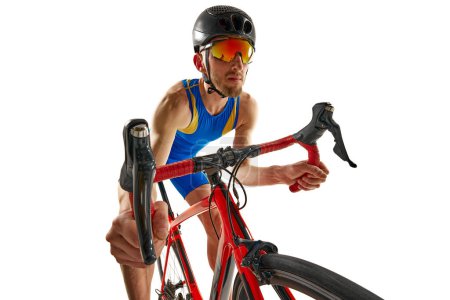 Photo for Man, athlete in motion, riding bike, training, competing isolated on white studio background. Concept of sport, active and healthy lifestyle, speed, endurance, hobby - Royalty Free Image