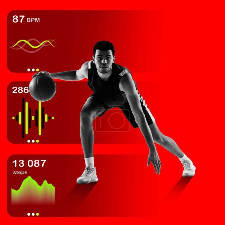 Imagen dinámica con joven concentrado, jugador de baloncesto dribleando pelota sobre fondo rojo brillante con gráficos de estadísticas de salud. Concepto de deporte, estilo de vida activo y pagano, entrenamiento, seguimiento