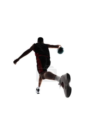 Photo for Back view of male basketball player in motion with ball, training isolated on white background. Concept of professional sport, competition, game, tournament, action - Royalty Free Image