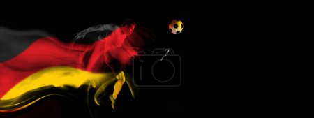 Photo for Concentrated and competitive man, football player in motion during game on black background with flag of Germany element. Concept of professional sport, competition, tournament. Banner. Sport event - Royalty Free Image