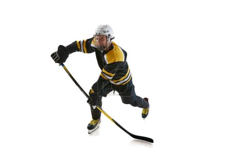 Photo for Focused and motivated man, hockey player wearing protective uniform and helmet, training, competing isolated on white background. Concept of professional sport, competition, game, tournament - Royalty Free Image