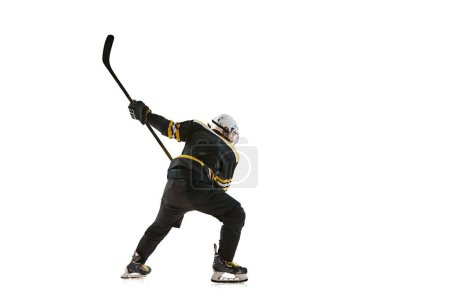 Photo for Competitive young man, hockey player in motion during game, training, competing isolated on white background. Concept of professional sport, competition, game, tournament - Royalty Free Image