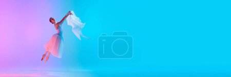 Photo for Ballet. Graceful ballerina performs with light fabric in neon light against vivid gradient background with copy space for text. Concept of art, movement, classical and modern fusion, beauty, fashion. - Royalty Free Image